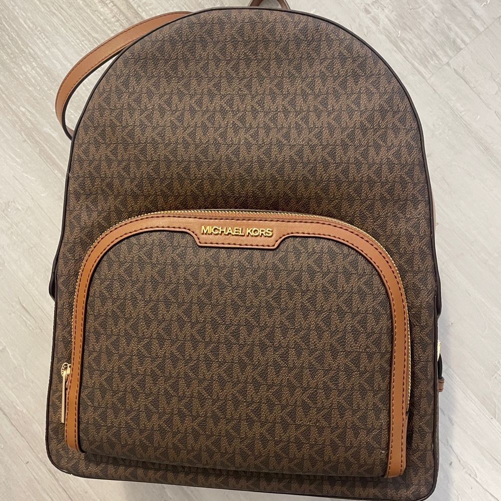 Authentic Michael Kors backpack never used excellent condition